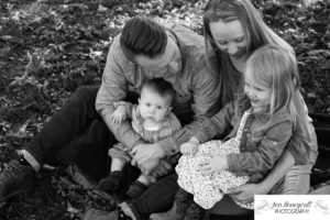 Littleton family photographer black and white unposed real moment close up baby girl toddler sisters love 