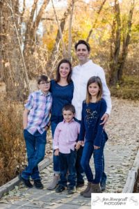 Littleton family photographer Fly'N B park yellow leaves trees Highlands Ranch Colorado photography bridge wooden wood boys sister