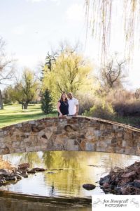 Littleton family photographer engagement session engaged wedding husband and wife to be Lakewood Country Club spring couple in love sunset green golf course bridge stone save the date announcement photography Colorado