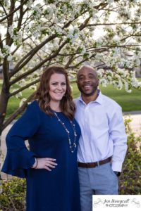 Littleton family photographer engagement session engaged wedding husband and wife to be Lakewood Country Club spring couple in love sunset green golf course white blooming trees save the date announcement photography Colorado