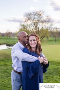 Littleton family photographer engagement session engaged wedding husband and wife to be Lakewood Country Club spring couple in love sunset green golf course bridge stone save the date announcement photography Colorado kiss kisses kissing fun