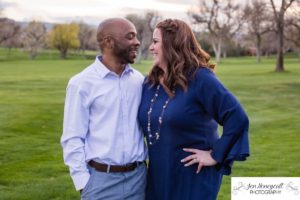 Littleton family photographer engagement session engaged wedding husband and wife to be Lakewood Country Club spring couple in love sunset green golf course bridge stone save the date announcement photography Colorado laughter laughing fun