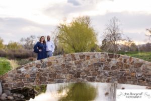 Littleton family photographer engagement session engaged wedding husband and wife to be Lakewood Country Club spring couple in love sunset green golf course bridge stone save the date announcement photography Colorado