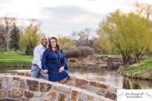 Littleton family photographer engagement session engaged wedding husband and wife to be Lakewood Country Club spring couple in love sunset green golf course bridge stone save the date announcement photography Colorado