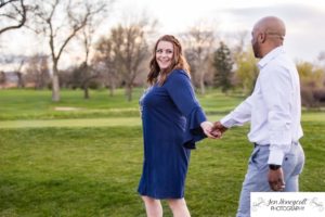 Littleton family photographer engagement session engaged wedding husband and wife to be Lakewood Country Club spring couple in love sunset green golf course bridge stone save the date announcement photography Colorado