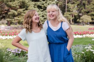 Littleton family photographer kids children sisters girls tween Denver Cheeseman Park photography laughter giggles unposed real