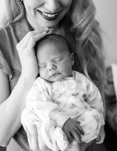 Littleton family photographer newborn baby new in home lifestyle photo session Colorado photography boy sweet cuddly sleeping babe motherhood mother son little
