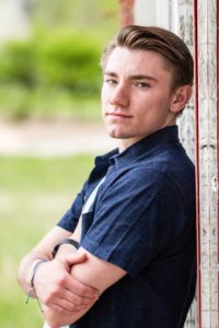 Littleton high school senior photographer Columbine portrait session boy Lakewood Heritage Center Belmar park Colorado photography class of 2020 foothills view mountains mountain teen handsome football player serious look