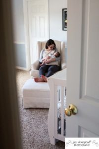 Littleton family photographer newborn new baby in home lifestyle session nursery mother son parenthood snuggles Colorado photography peek-a-boo look quiet time love bond bonding