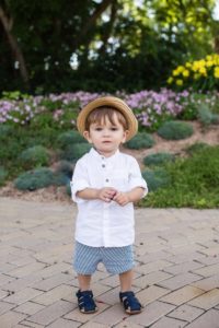 Littleton family photographer child children little boy with a cute hat summer flowers Highlands Ranch Mansion Colorado photography one year old milestone session brother