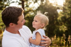 Littleton family photographer father daughter love Colorado photography golden light natural sunset little baby daddy's girl