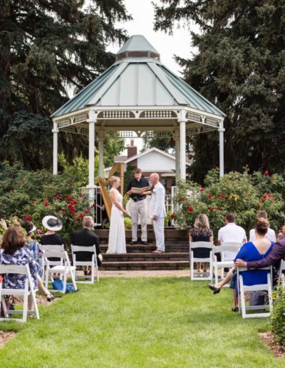 Littleton wedding photographer Colorado photography War Memorial Rose Garden gazebo summer weddings harp player roses outdoor ceremony love intimate rain and sun bride groom natural light husband wife married marriage