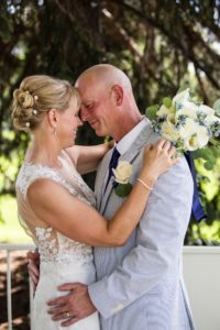 Littleton wedding photographer War Memorial Rose Garden Colorado photography bride and groom in love married marriage outdoor ceremony gazebo summer weather rain sun nose to nose in love flowers dress husband wife I do