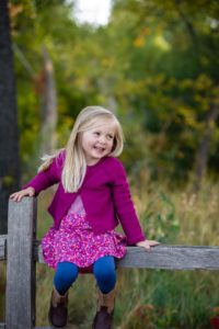 Littleton family photographer child kid Colorado fall little girl Prospect Park Arvada trail wooden fence