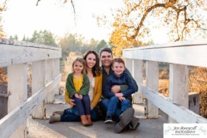 Littleton family photographer in Colorado at Writer's Vista park Centennial Highline Trail fall leaves golden hour sunset light big brother little sister kids children natural smiles real life parenthood bridge