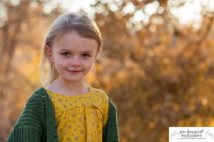 Littleton family photographer in Colorado at Writer's Vista park Centennial Highline Trail fall leaves golden hour sunset light big brother little sister kids children natural smiles real life parenthood