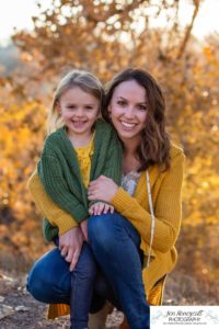 Littleton family photographer in Colorado at Writer's Vista park Centennial Highline Trail fall leaves golden hour sunset light big brother little sister kids children natural smiles real life parenthood mother daughter