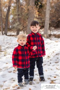 Littleton family photographer Fly'N B park in Highlands Ranch Colorado photography boys brothers pregnant baby bump mom dog Yorkie snow fall trail matching jackets Christmas