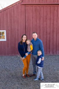 Littleton family photographer in Colorado at the Lakewood Heritage Center with kids children big brother little sister old barns joy Christmas snuggles cold fall winter