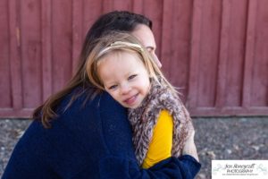 Littleton family photographer in Colorado at the Lakewood Heritage Center with kids children big brother little sister old barns joy Christmas snuggles cold fall winter