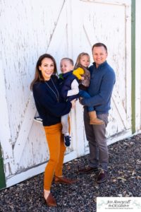 Littleton family photographer in Colorado at the Lakewood Heritage Center with kids children big brother little sister old barns joy Christmas snuggles cold fall winter