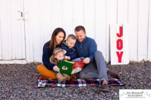 Littleton family photographer in Colorado at the Lakewood Heritage Center with kids children big brother little sister old barns joy Christmas snuggles cold fall winter