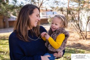 Littleton family photographer in Colorado at the Lakewood Heritage Center with kids children big brother little sister old barns joy Christmas snuggles cold fall winter