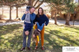 Littleton family photographer in Colorado at the Lakewood Heritage Center with kids children big brother little sister old barns joy Christmas snuggles cold fall winter