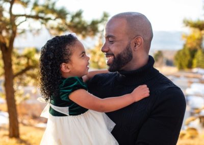 Littleton family photographer in Colorado father daughter Daddy's little girl winter sunset light Highlands Ranch Mansion foothills real moment love