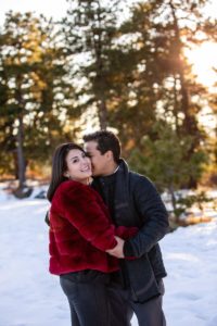 Littleton family photographer in Colorado at Mt. Falcon park in the winter time with snow engagement session engaged future bride and groom husband wife in love