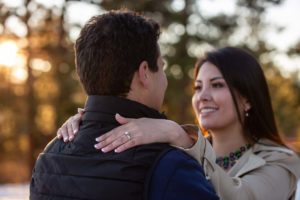 Littleton engaged couple photographer engagement photo session in Colorado family Mt. Falcon in love marriage married kisses kissing kiss pretty diamond ring sunset golden hour snow winter Bolivia cute