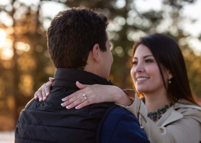 Littleton engaged couple photographer engagement photo session in Colorado family Mt. Falcon in love marriage married kisses kissing kiss pretty diamond ring sunset golden hour snow winter Bolivia cute