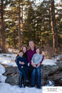 Littleton family photographer in Colorado with snow at Mt. Falcon park big sister little brother sweet
