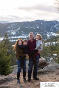Littleton family photographer in Colorado with snow at Mt. Falcon park big sister little brother sweet