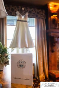 Littleton wedding photographer in Colorado at the Lakewood Country Club and golf course bride groom winter snow stone bridge fedora hat marriage married cake white dress in love family ceremony