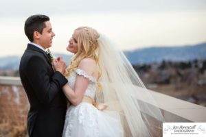 Littleton wedding photographer in Colorado at Cherry Hills Community church Highlands Ranch foothills Christ centered Christian bride groom husband wife married marriage love getting ready long white dress tuxedo bridesmaids groomsmen winter reception young college father mother son daughter stained glass beautiful ring suspenders navy blue pretty flowers