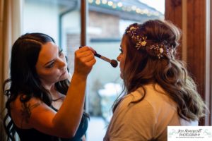 Littleton wedding photographer in Colorado at the Lakewood Country Club and golf course bride groom winter snow stone bridge fedora hat marriage married cake white dress in love family ceremony