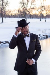 Littleton Colorado wedding photographer groom fedora hat snow winter Lakewood Country Club and golf course marriage