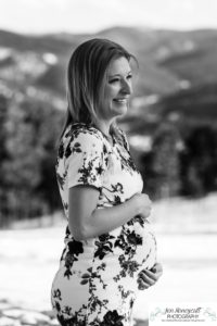 Littleton family maternity photographer in Colorado Mt. Falcon park snow spring baby bump pregnant husband and wife mountain view mountains foothills sunset natural golden light