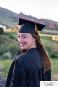 Littleton high school senior portrait photographer cap and gown photo session Morrison Mt. Falcon red rocks class of 2020 Broomfield CSU Colorado State University mask pandemic quarantine graduate graduation tassle summer