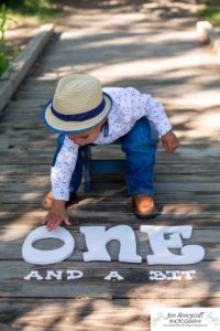 Littleton family and child photographer in Colorado one year old milestone session little boy hat Fly'N B park Highlands Ranch summer momma's boy mother son cute baby pandemic birthday COVID-19 corona virus