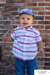 Littleton family and child photographer in Colorado one year old milestone session little boy hat Fly'N B park Highlands Ranch summer momma's boy mother son cute baby pandemic birthday COVID-19 corona virus holding a stick