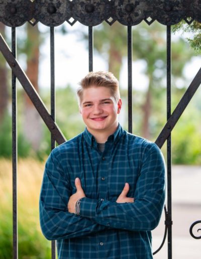 Littleton high school senior photographer Colorado Highlands Ranch football player Thunder Ridge class of 2021 boy strong college field natural light photography