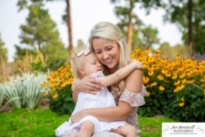 Littleton family photographer in Colorado at the Highlands Ranch Mansion two year old baby girl dog summer stone building flowers beautiful mother daughter father