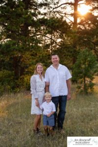 Littleton family photographer in Colorado at Mt. Falcon park mountain views view of foothills boy mother father son love summer sunset natural light photography