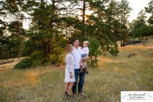 Littleton family photographer in Colorado at Mt. Falcon park mountain views view of foothills boy mother father son love summer sunset natural light photography