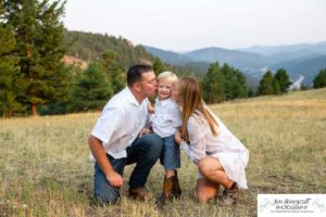 Littleton family photographer in Colorado at Mt. Falcon park mountain views view of foothills boy mother father son love summer sunset natural light photography