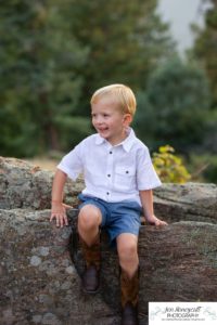 Littleton family photographer in Colorado at Mt. Falcon park mountain views view of foothills boy mother father son love summer sunset natural light photography