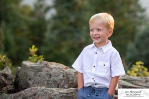 Littleton family photographer in Colorado at Mt. Falcon park mountain views view of foothills boy mother father son love summer sunset natural light photography