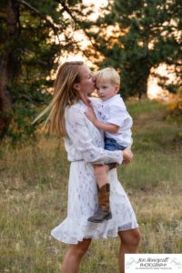 Littleton family photographer in Colorado at Mt. Falcon park mountain views view of foothills boy mother father son love summer sunset natural light photography